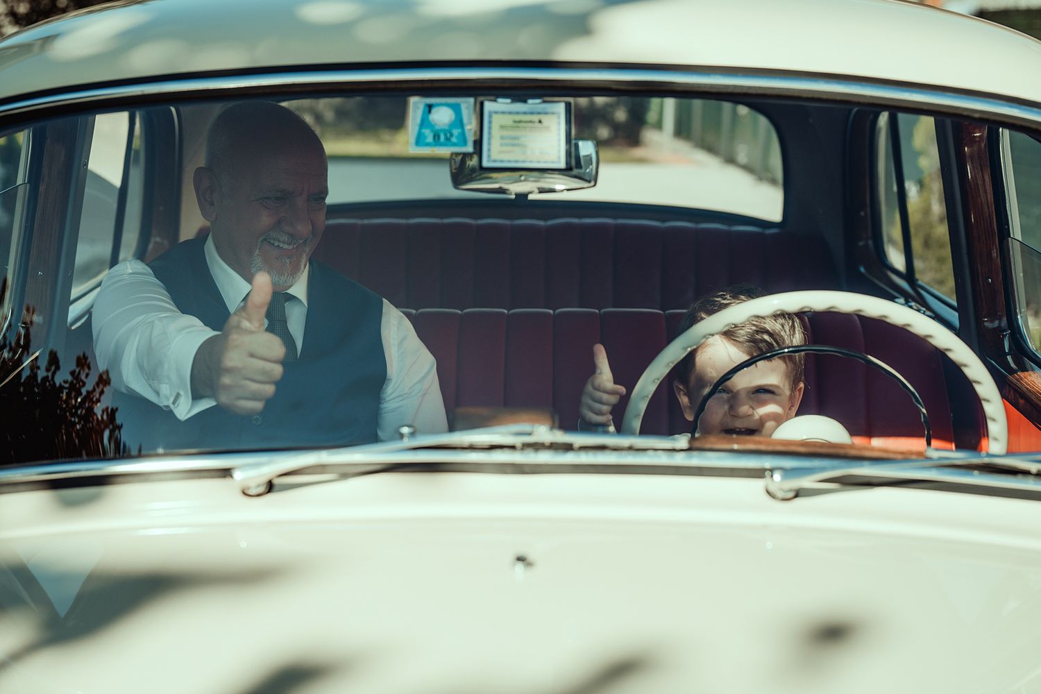 Interior shots of a classic car with retro red upholstery and chrome details.