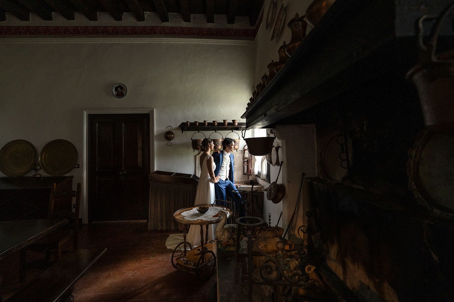Dark interior hallway with dramatic shadows and architectural details.