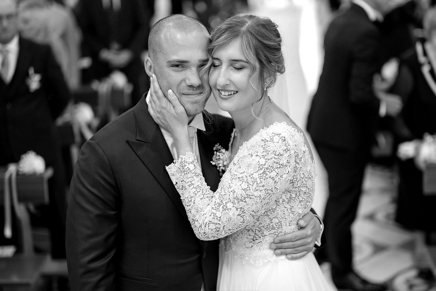 Newlyweds share joyful laughter during an intimate moment at their wedding.