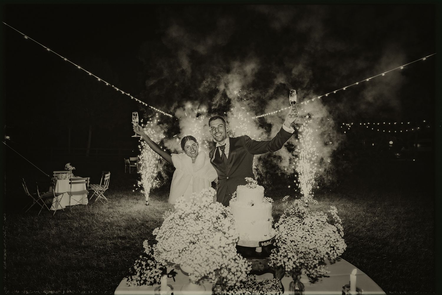 A vintage black and white photograph strip shows people gathered outdoors at what appears to be a social event.