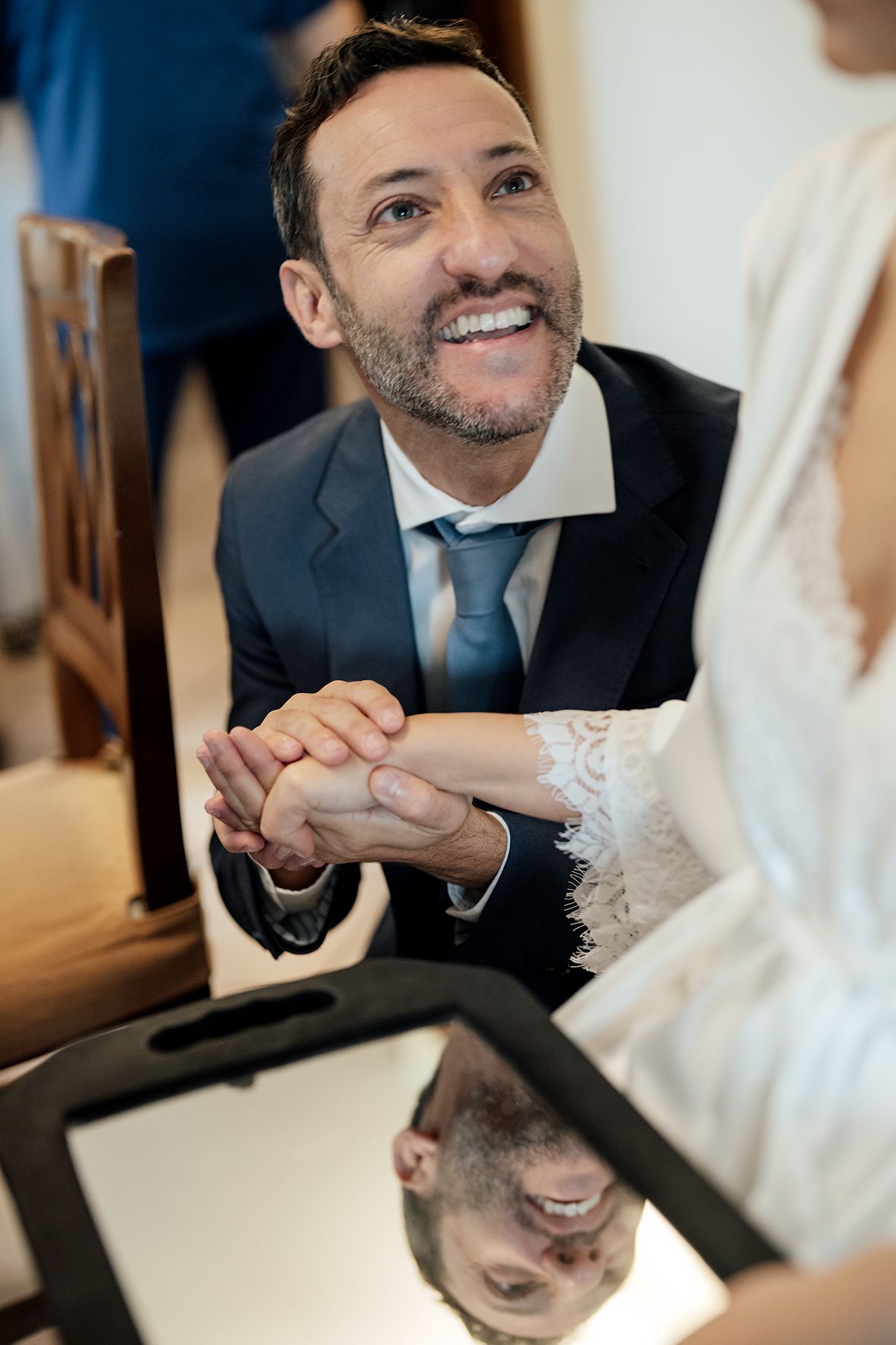 Candid moments captured during formal event showing genuine laughter and interaction.
