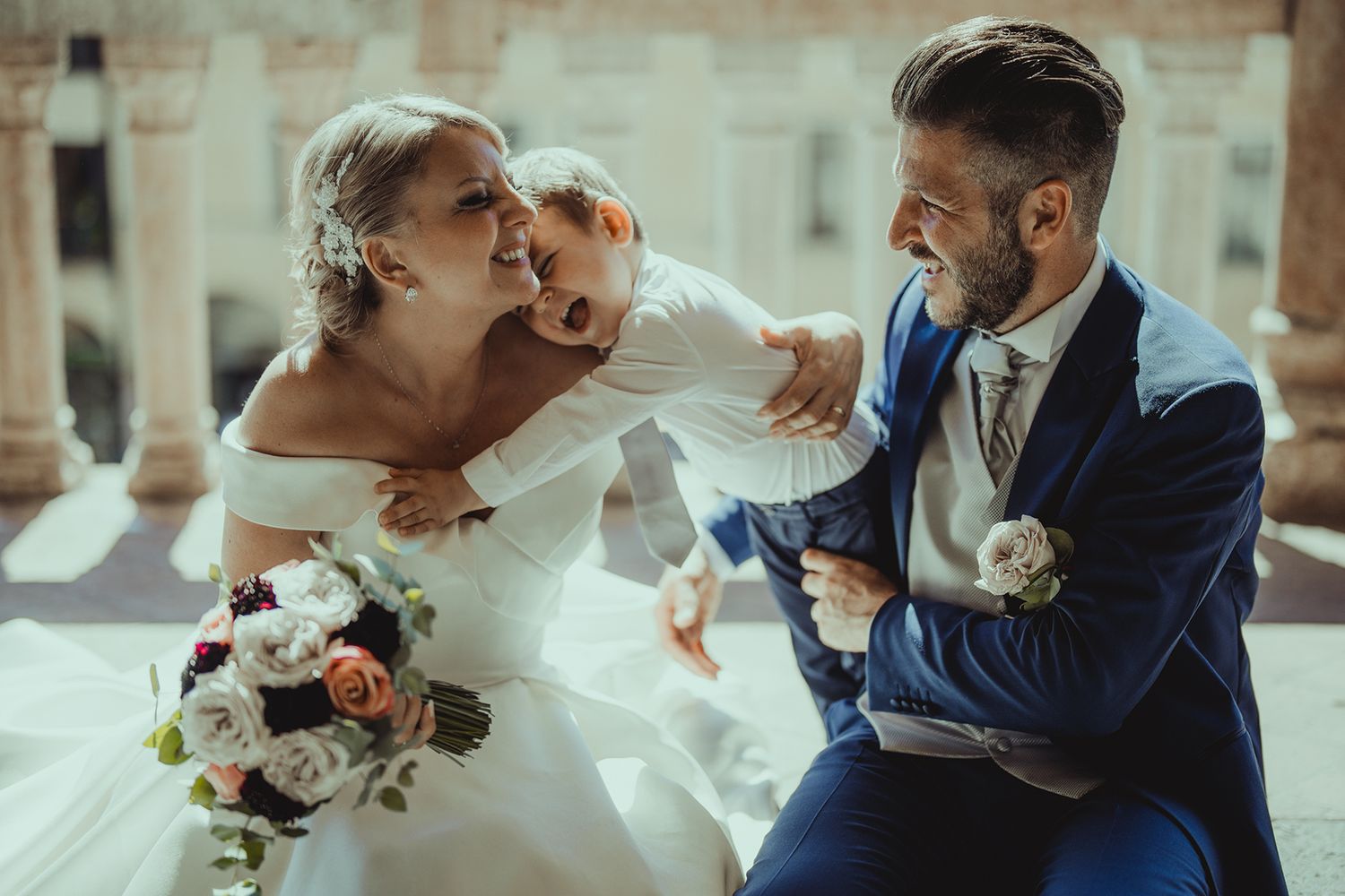 Romantic wedding couple sharing intimate moments in a rustic setting.