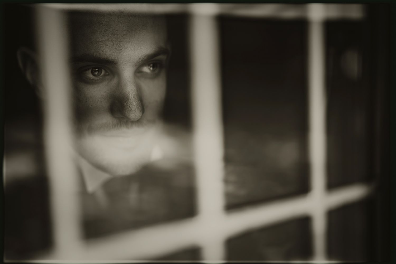 A black and white film strip showing several sequential frames with dark and light contrasting elements.