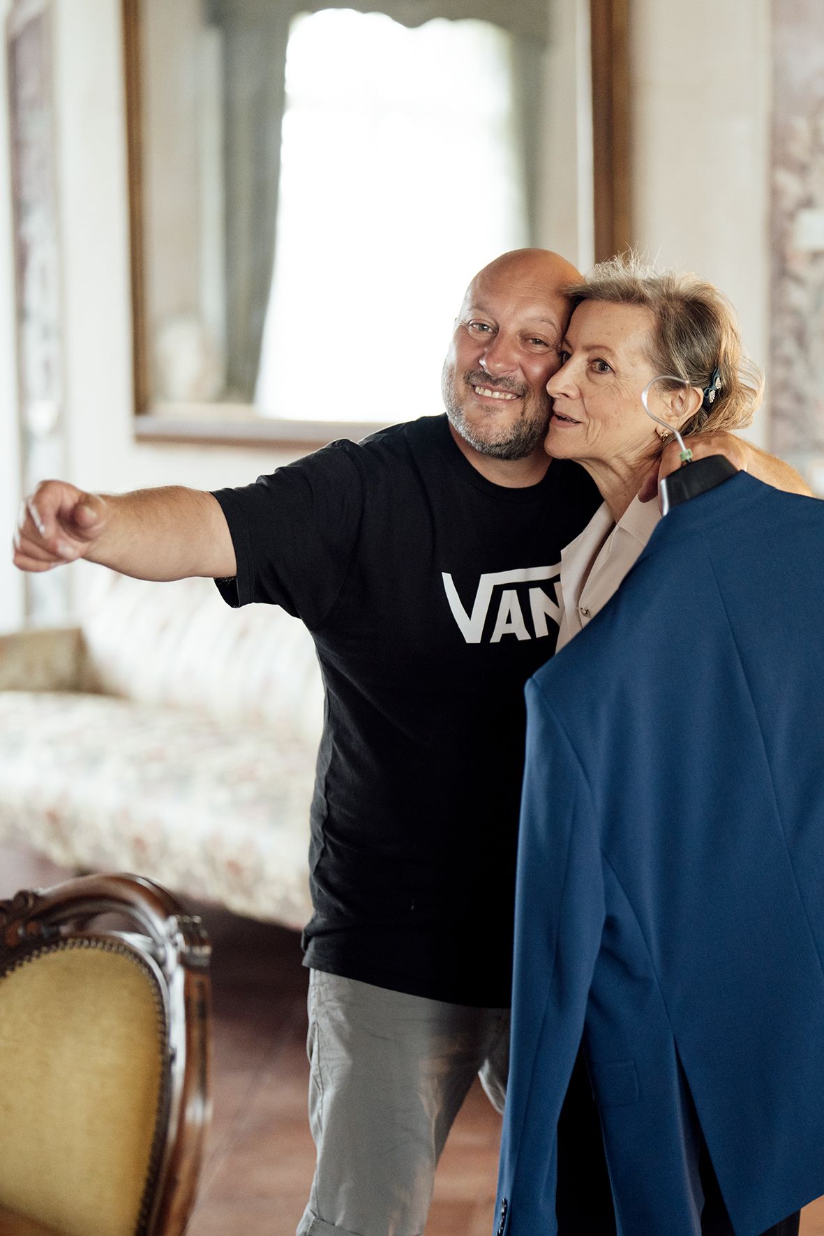 Two people demonstrating self-defense techniques in a well-lit interior space.