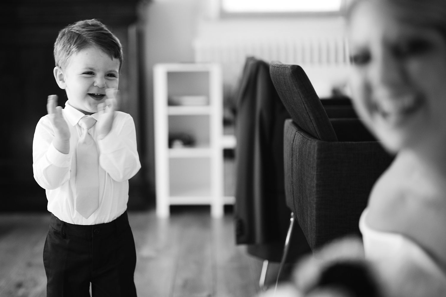 Black and white photo of young ring bearer in formal attire.