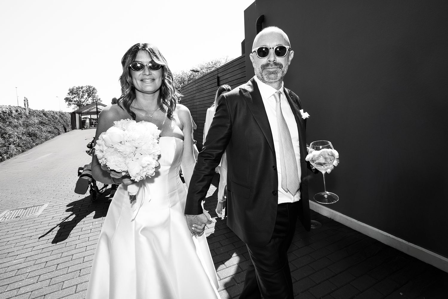 Black and white wedding portraits showing romantic moments between newlyweds.