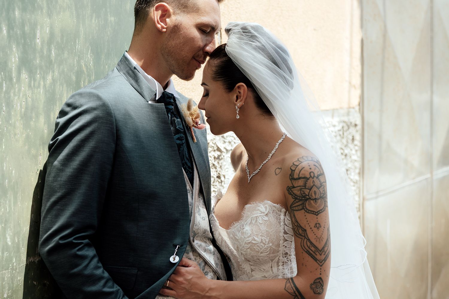 Romantic wedding portraits captured against soft, dreamy background.