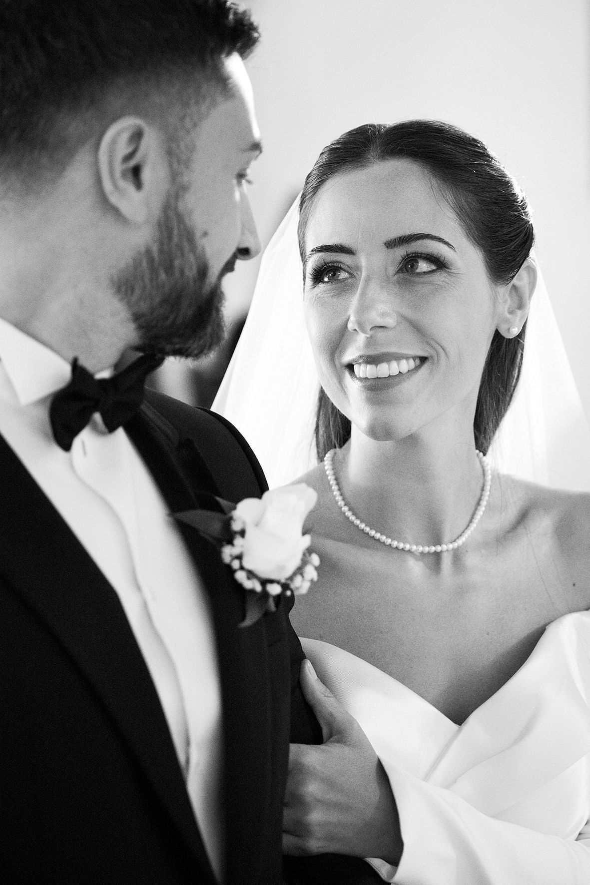 Romantic black and white portrait series capturing intimate wedding moments.