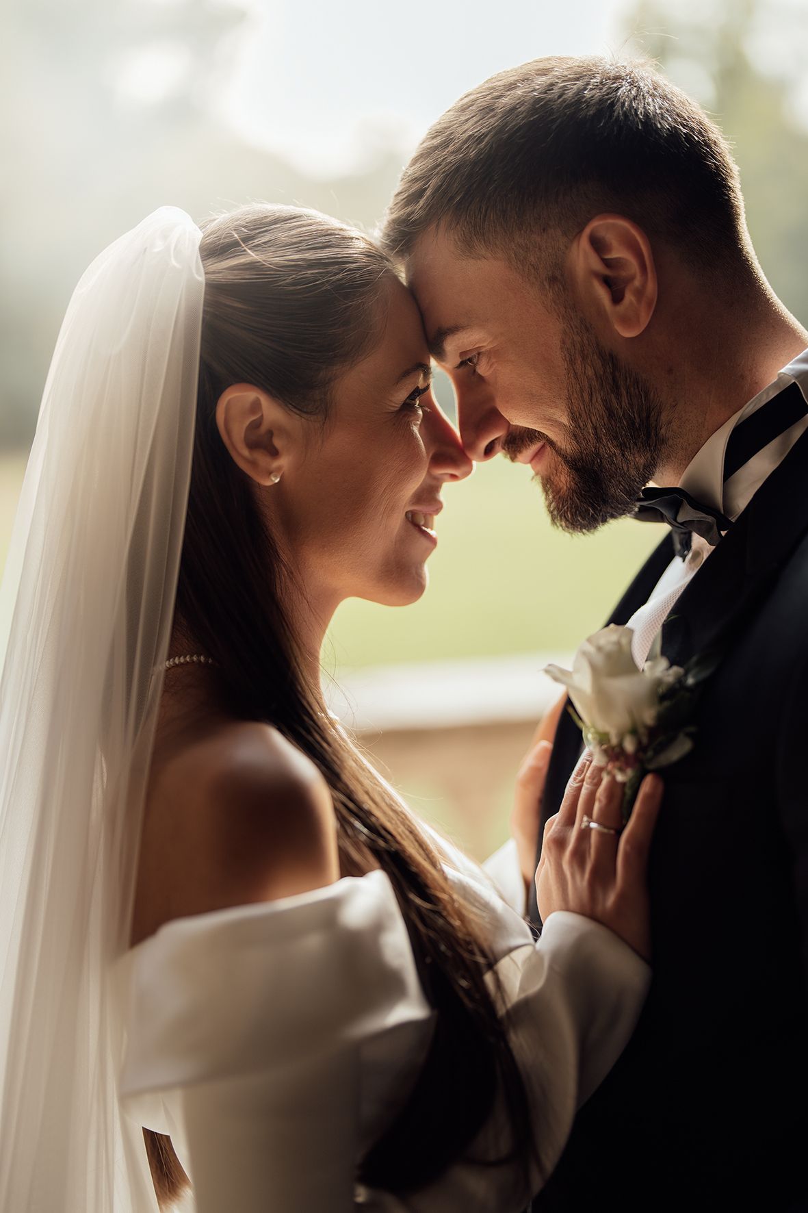Romantic close-up shots of tender moments between newlyweds in classic wedding attire.