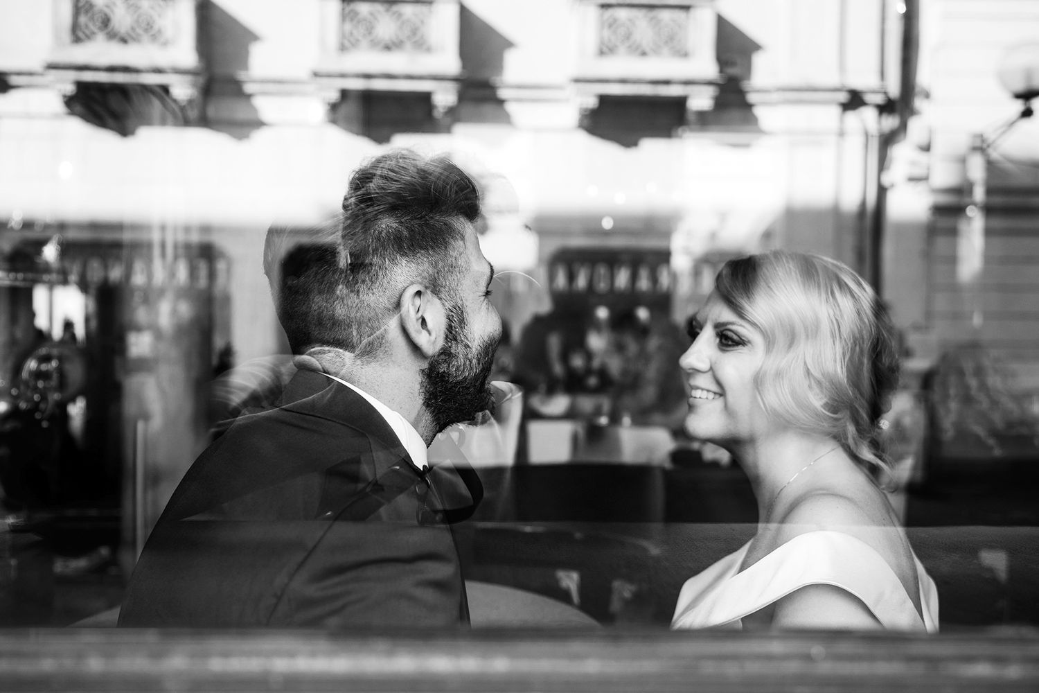Artistic black and white wedding photographs showing intimate moments and reflections.