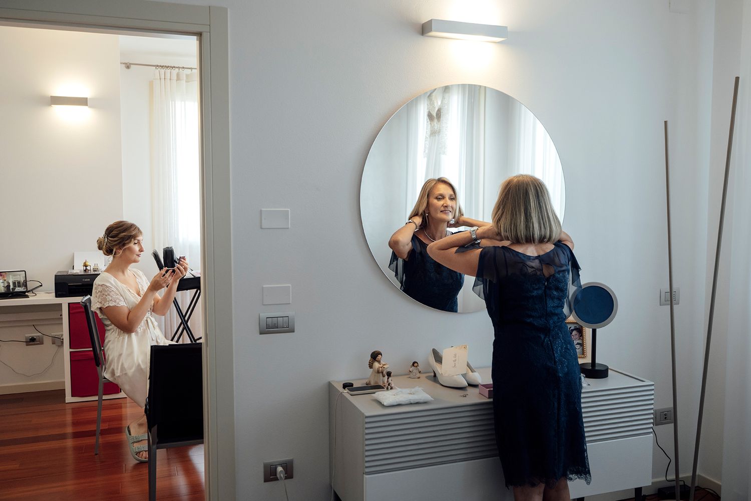 Interior scene showing preparations with mirrors and natural lighting.