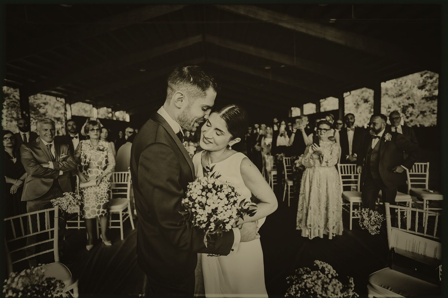 A black and white photo collage showing various moments from an elegant wedding reception celebration.