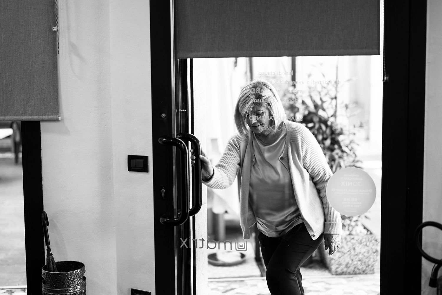 Black and white architectural shots showing interior hallway and window details.