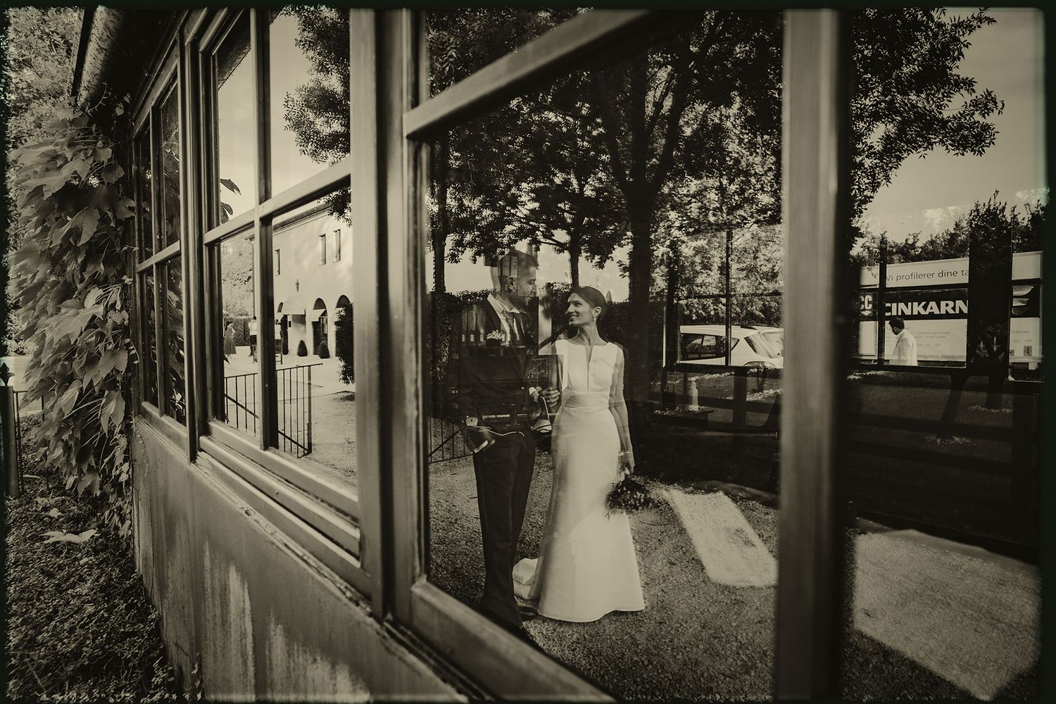 A series of vintage black and white photographs showing historic street scenes with sidewalks and buildings.