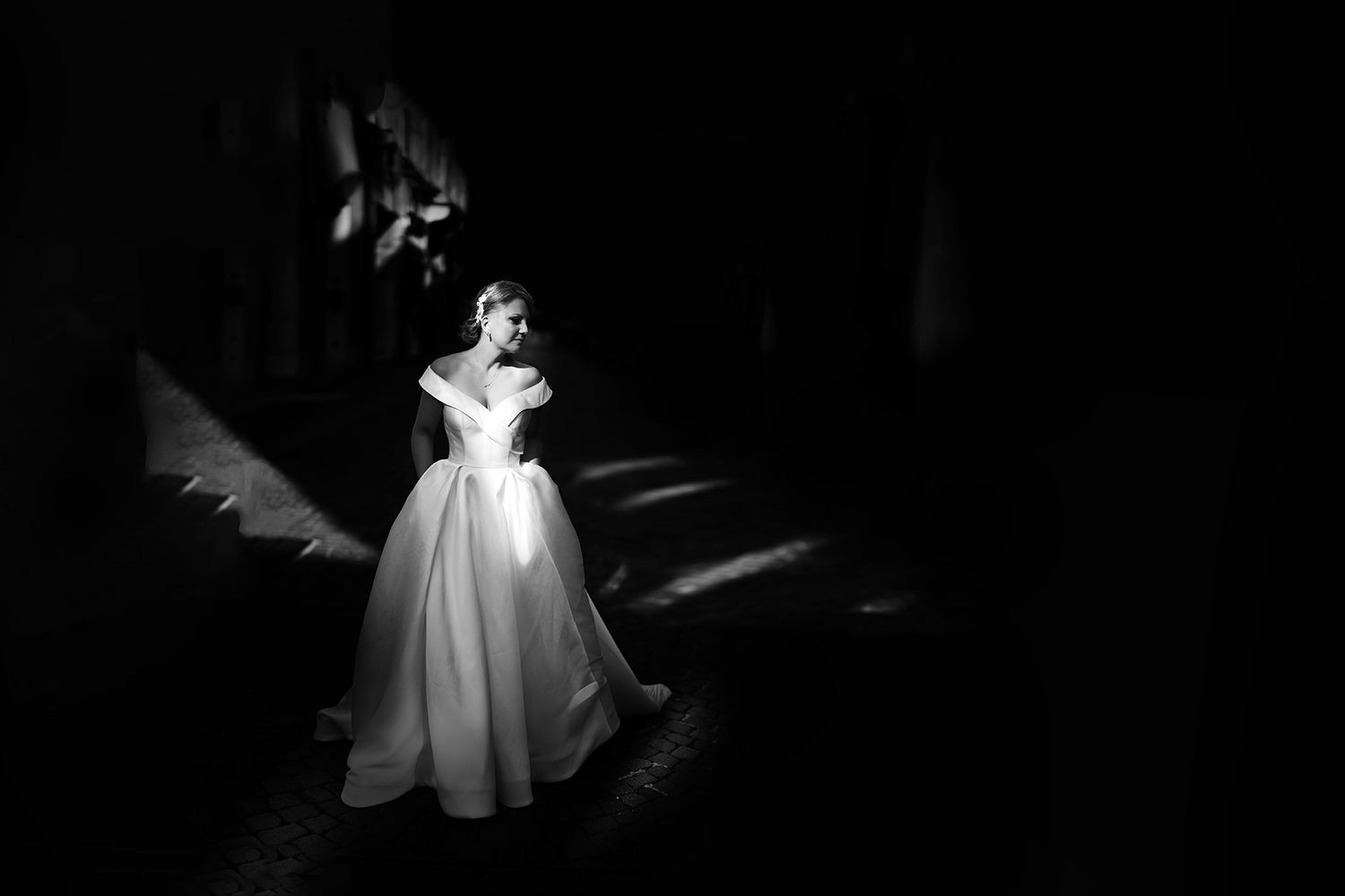 A sequence of black and white photos showing a ghost-like figure illuminated in darkness, creating an eerie atmospheric effect.