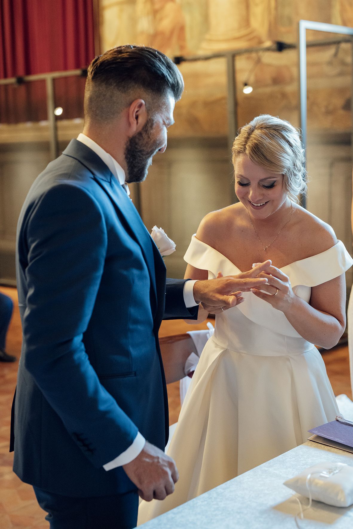 Wedding couple in formal attire sharing intimate moments during their reception celebration.