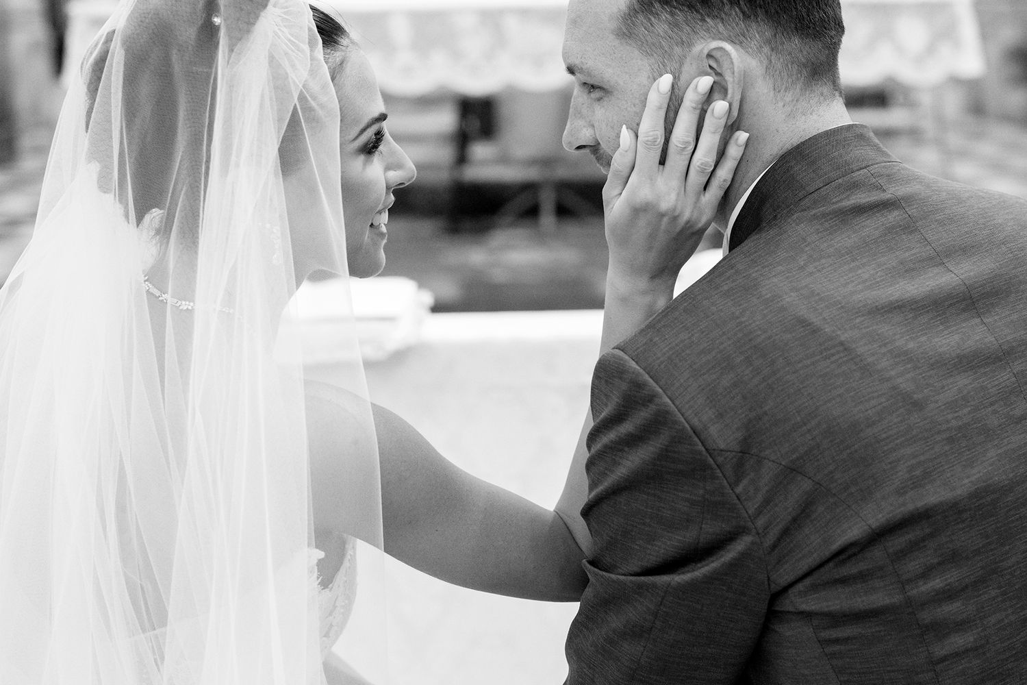Emotional moment shared between couple during wedding ceremony.