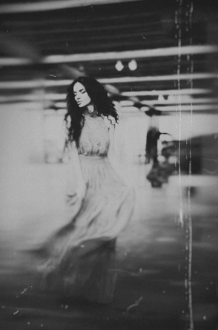 Dreamy black and white sequence showing flowing movement with blurred effects.