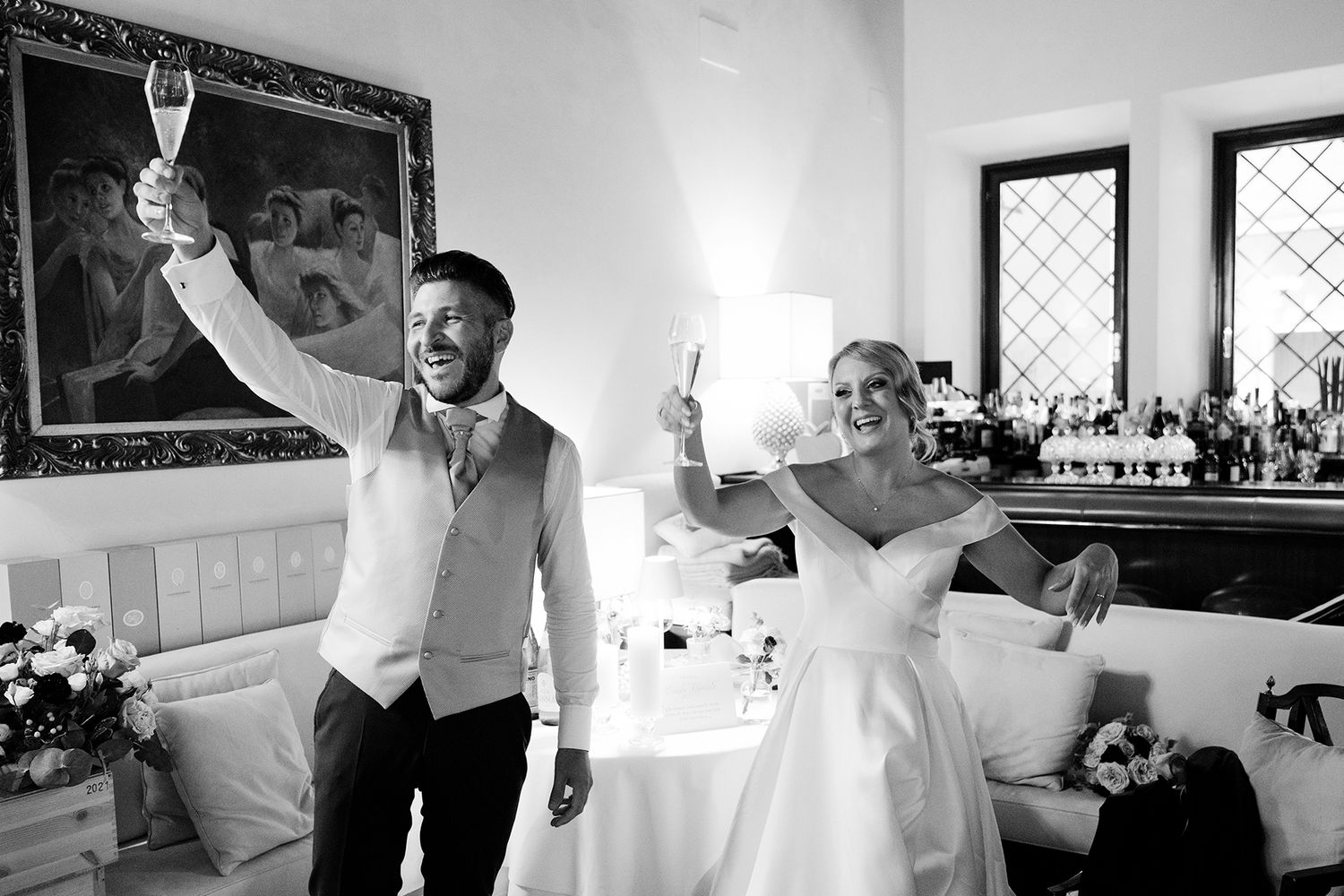 Series of candid wedding reception photos showing guests enjoying themselves in a bright indoor venue.