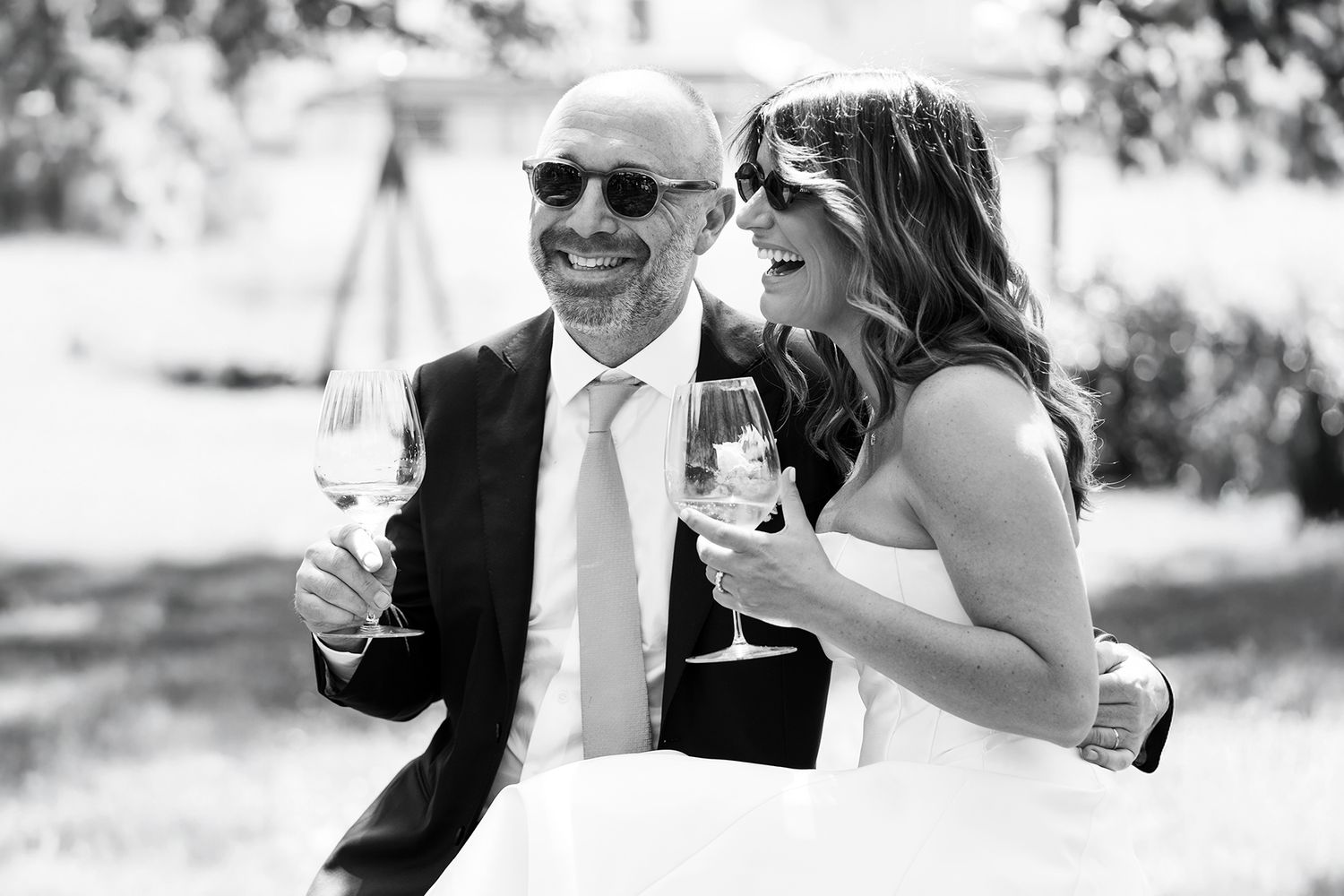Black and white photos capturing candid moments of joy during wedding celebrations.