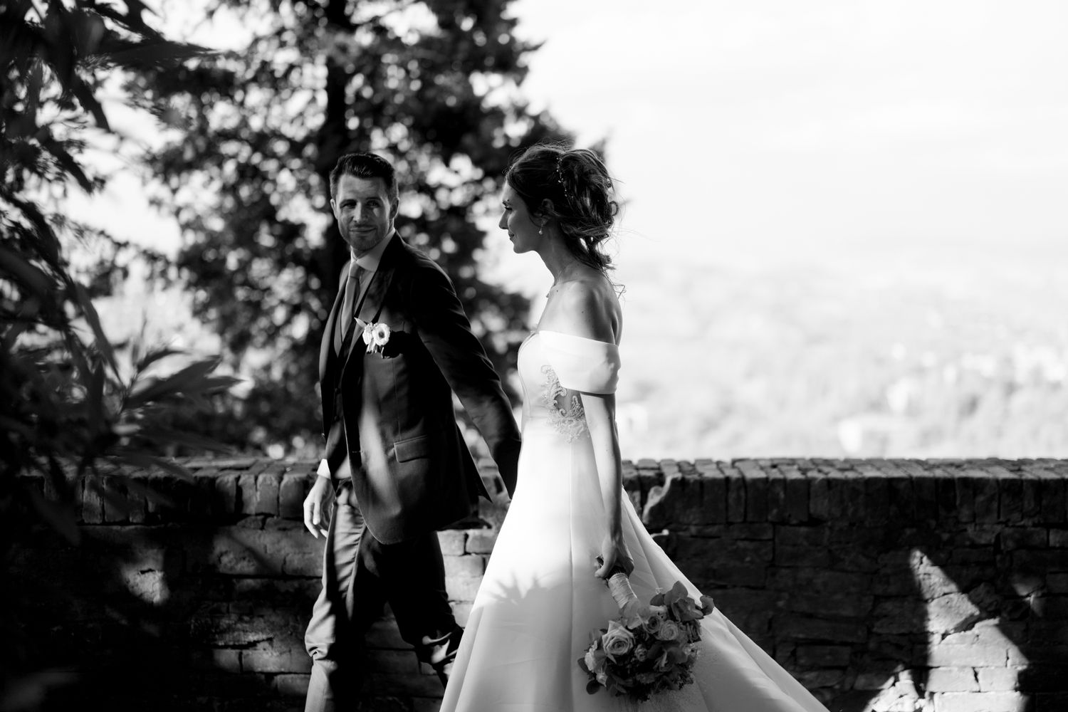 Elegant bridal portraits taken outdoors with natural lighting and scenic backdrop.