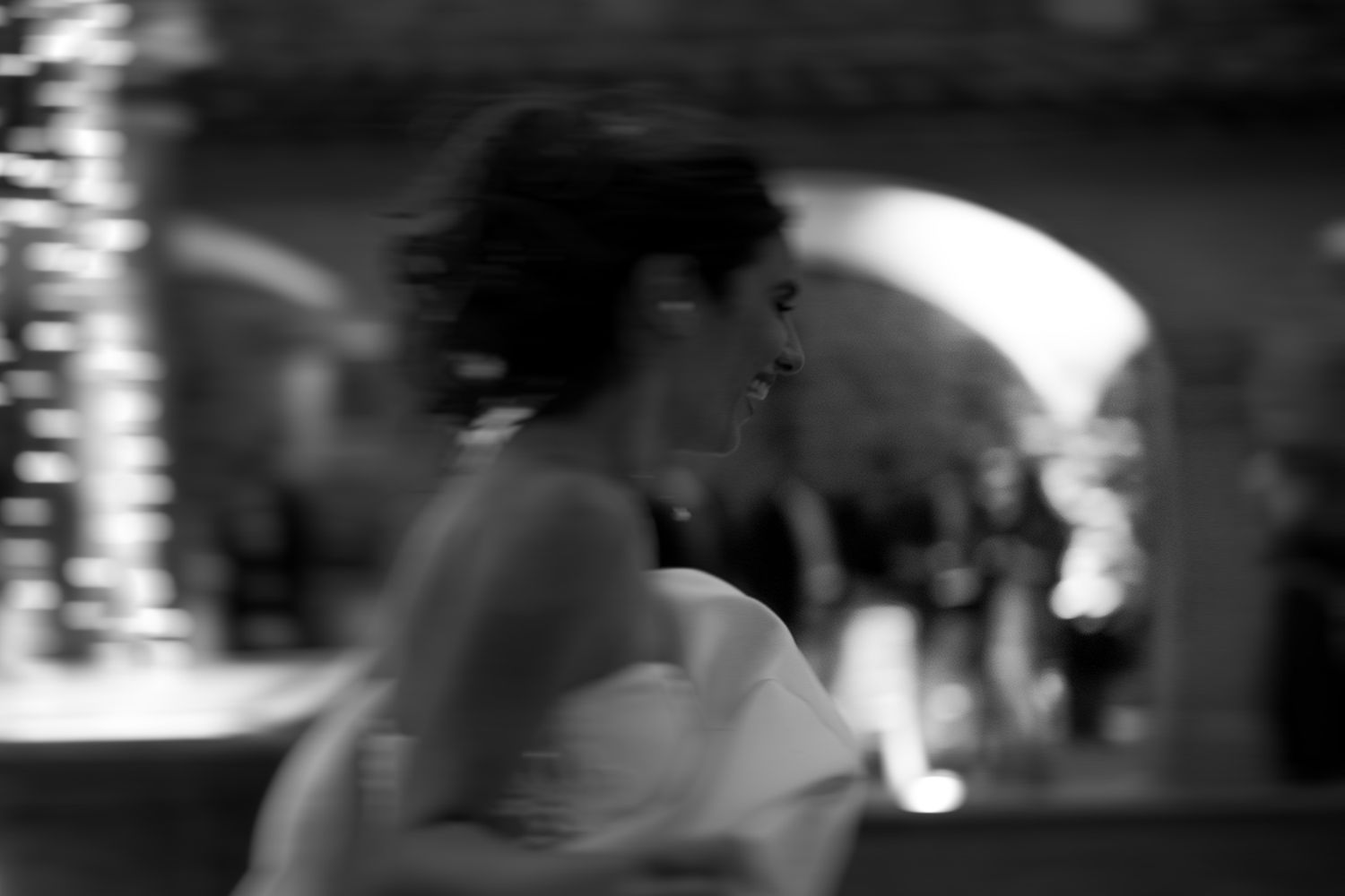 Dark atmospheric reception scene with silhouettes dancing under dim lighting.