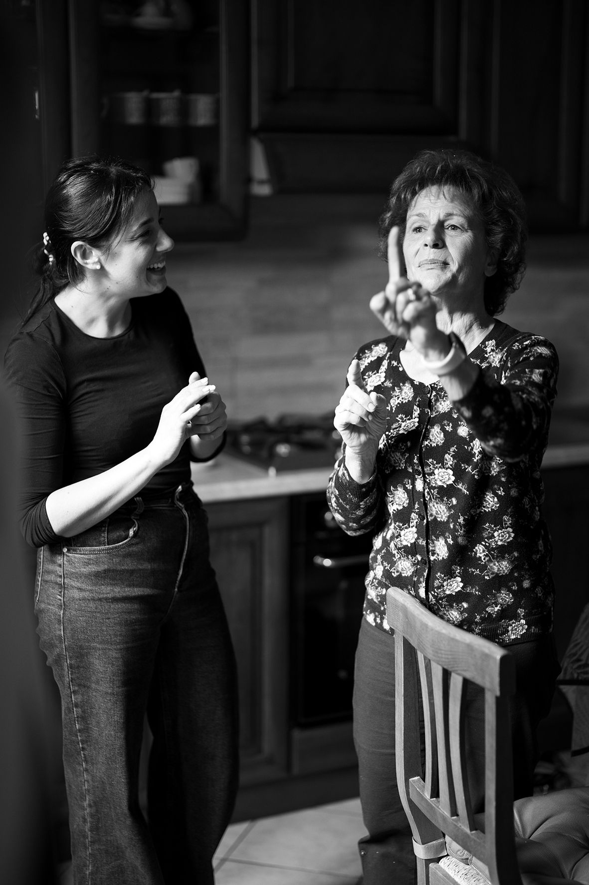 Black and white candid moments captured in dramatic lighting.