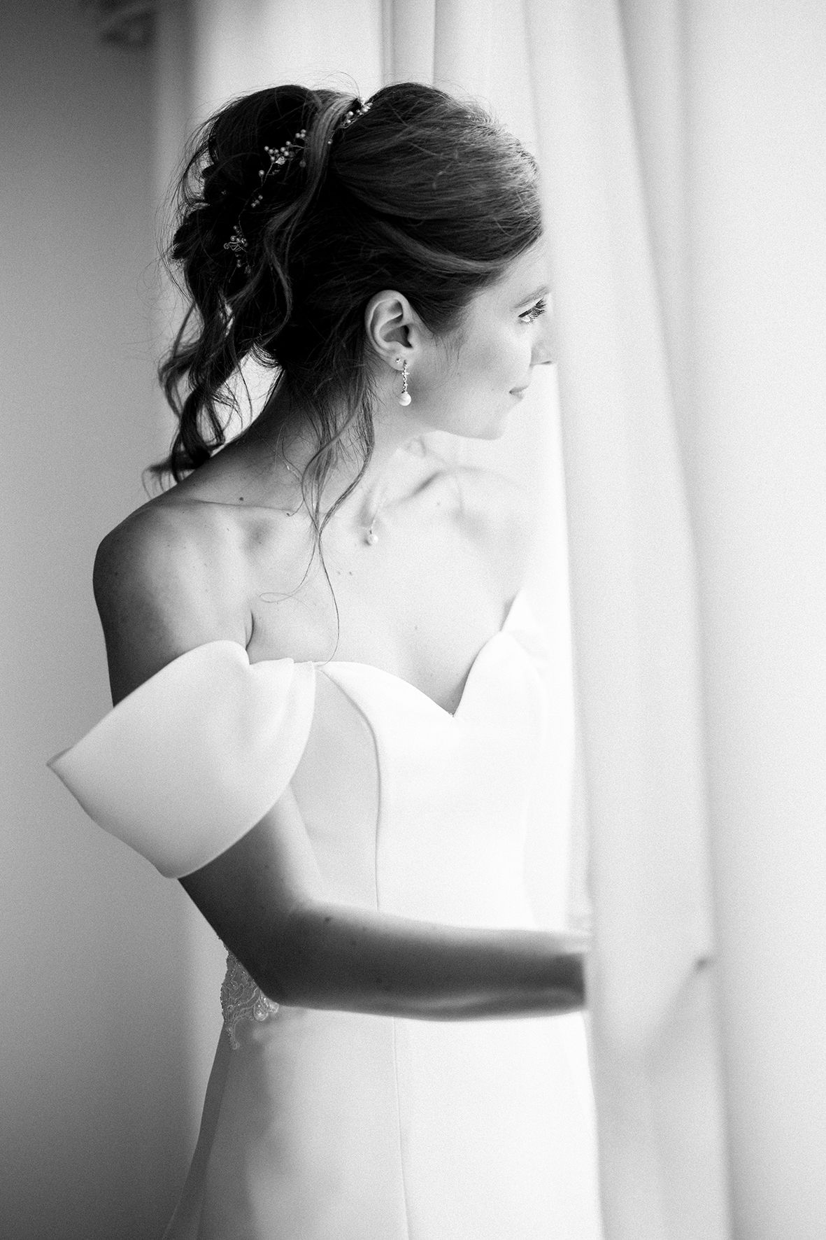 Black and white series showing details of classic strapless wedding gown.