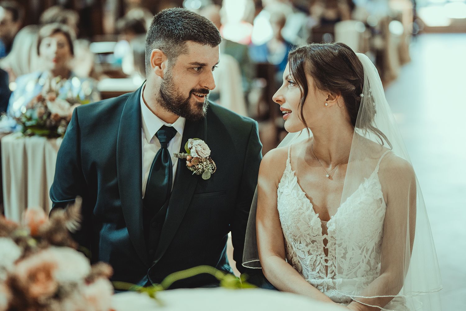 A romantic moment shared between newlyweds during their church wedding ceremony.