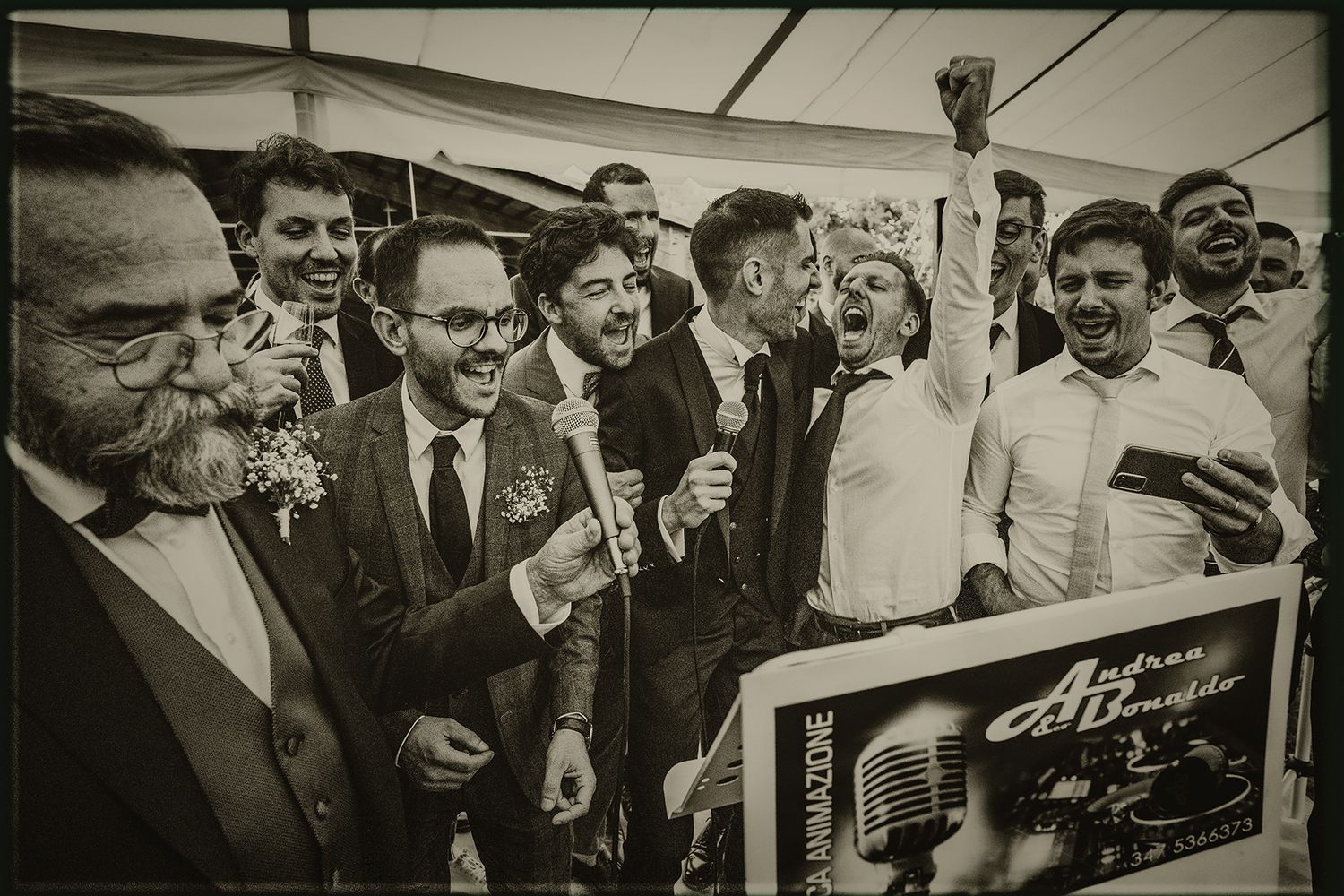 A vintage black and white photograph showing a crowd of people gathered around what appears to be a promotional display.