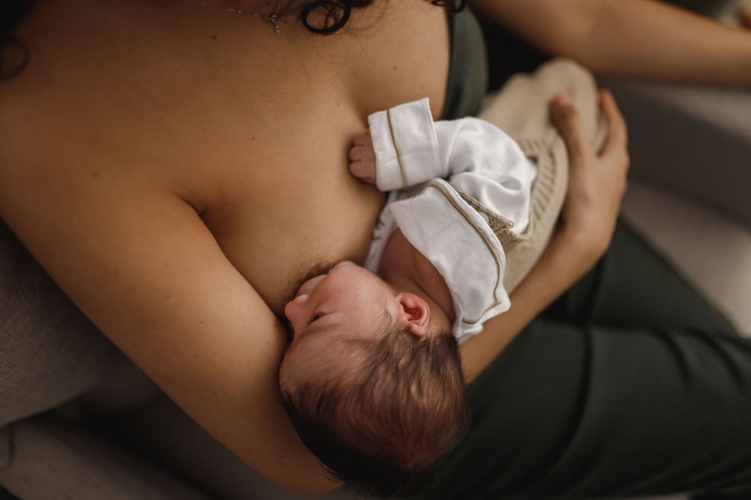 Intimate lifestyle portrait session showing tender moments in natural window light.