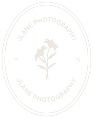 Circular watermark or logo designs in light beige tones arranged in a repeating pattern against a white background.