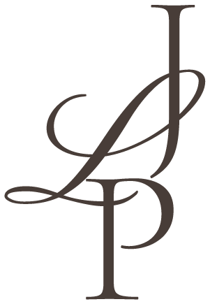 Elegant black monogram combining J and P letters in a flowing script style.