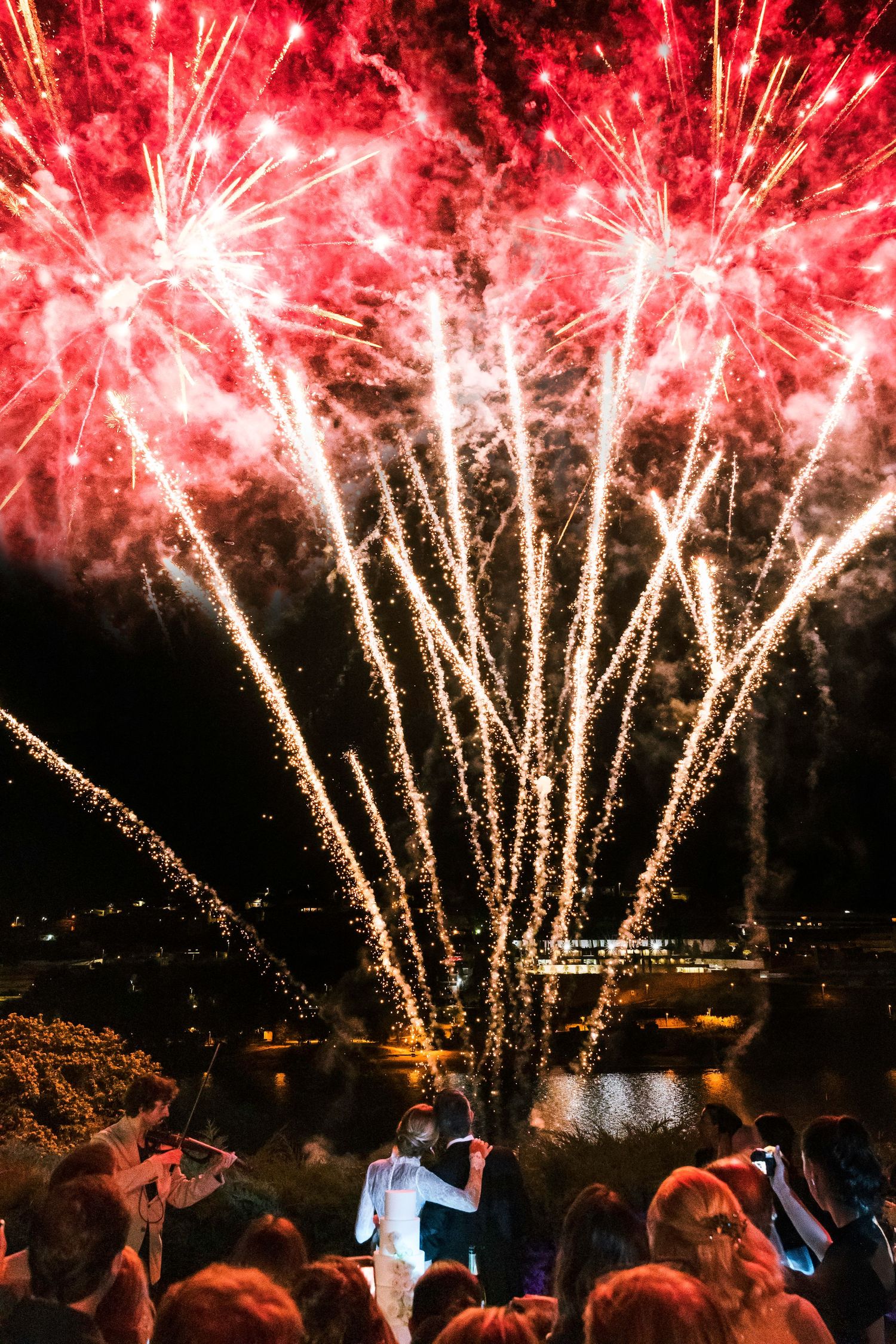 Fireworks explode over the wedding celebration in Porto, captured in a cinematic, emotional style.