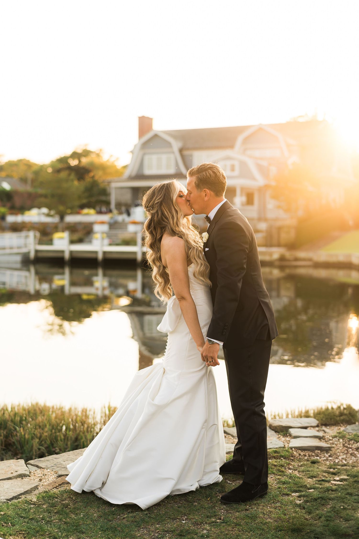 Newlyweds kiss at sunset during Long Island wedding