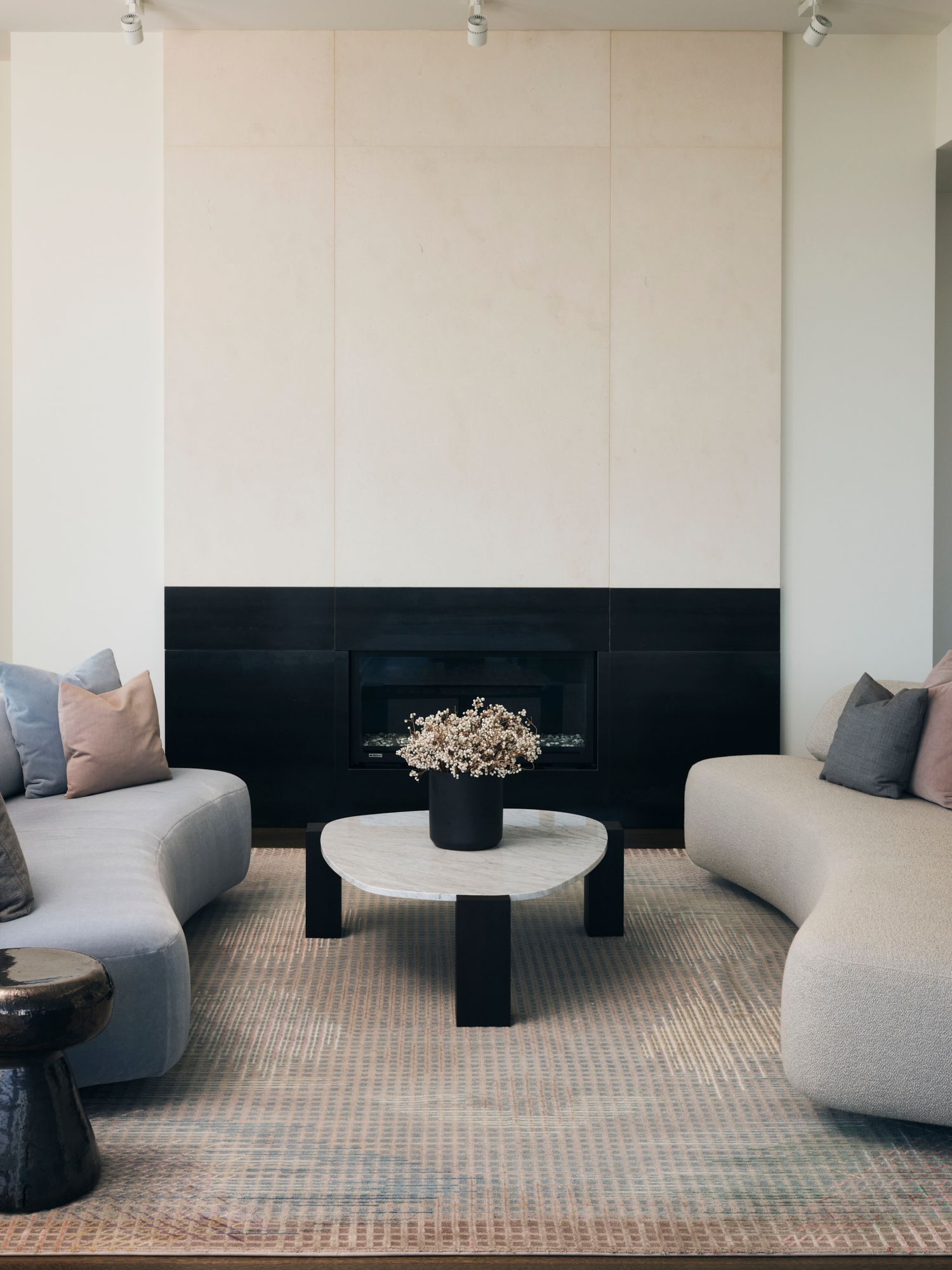 Fireplace and couches in a penthouse in Seattle, WA