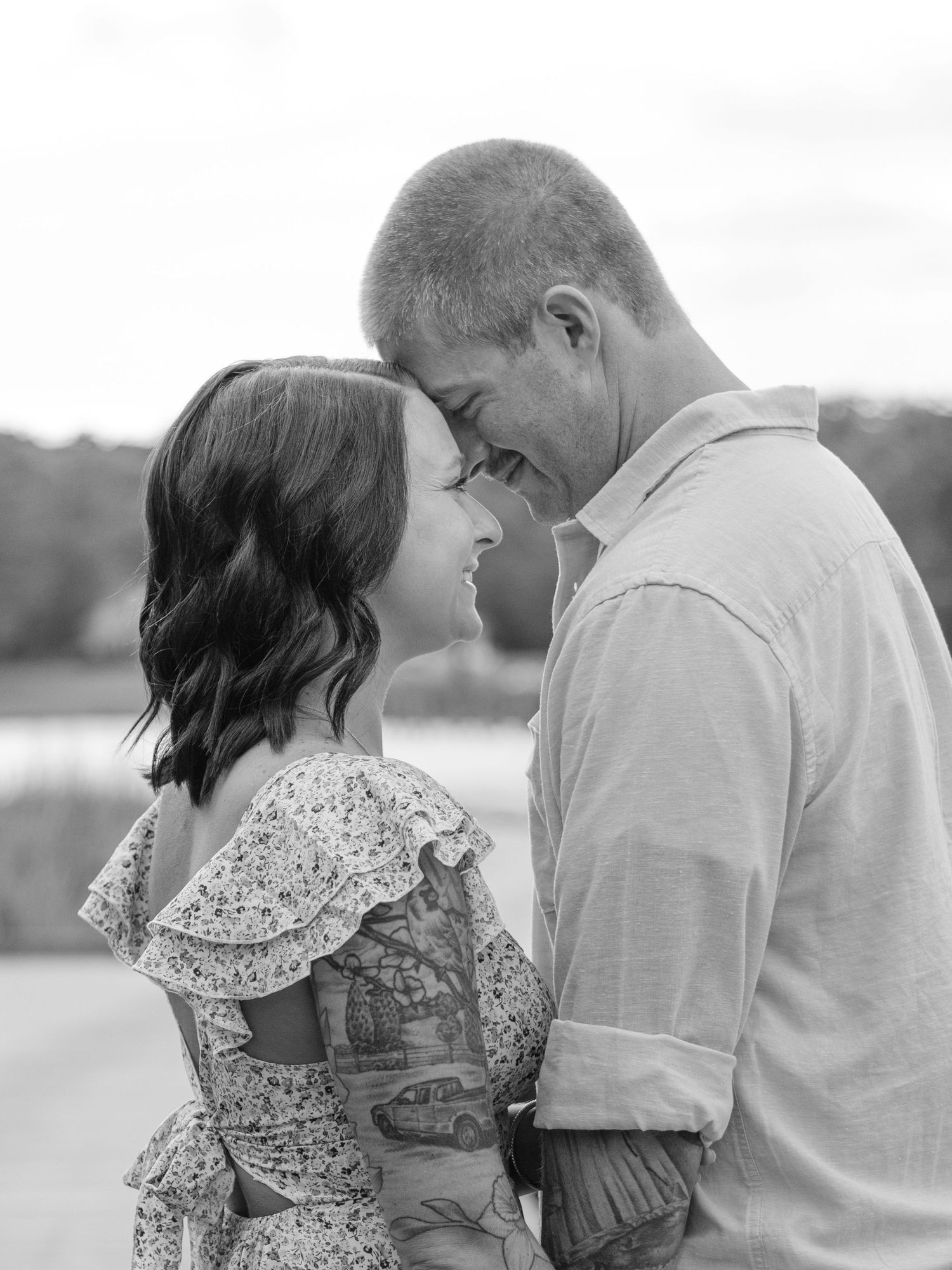 Couple sharing tender moments in a romantic black and white photo sequence showing their sweet embraces and interactions.