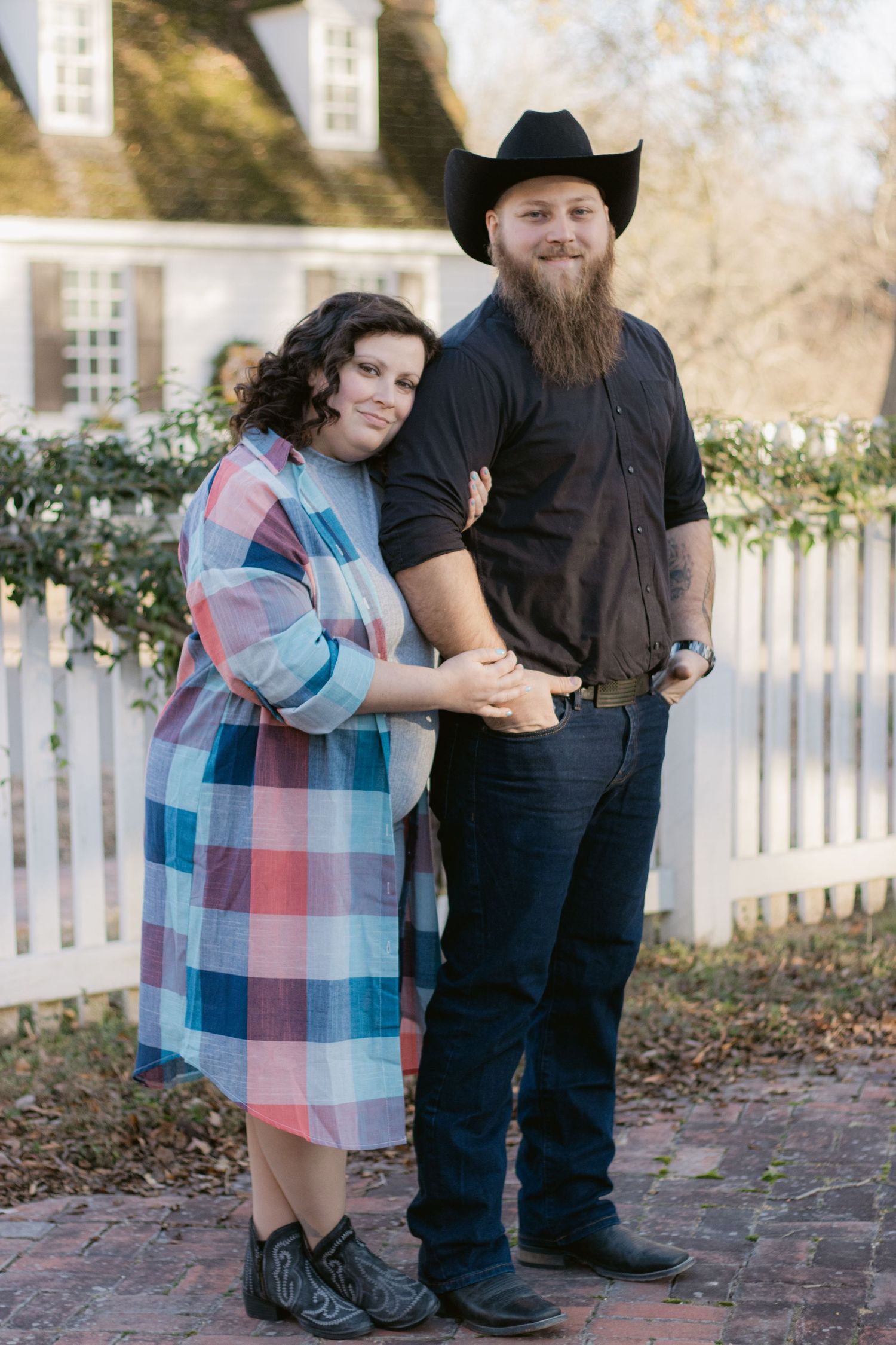 A series of outdoor portraits showing close-up interactions between two people at different angles in front of a white fence.
