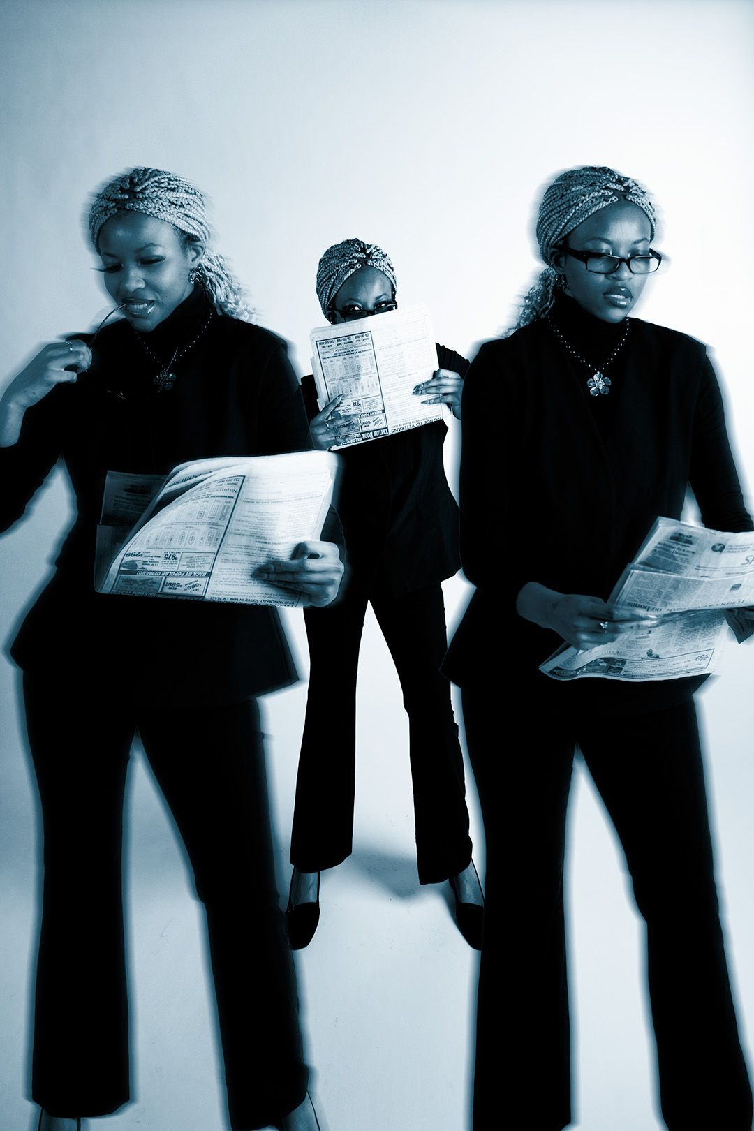 Blue-toned multiple-exposure photo of a woman in a black suit reading a newspaper in three dynamic poses.