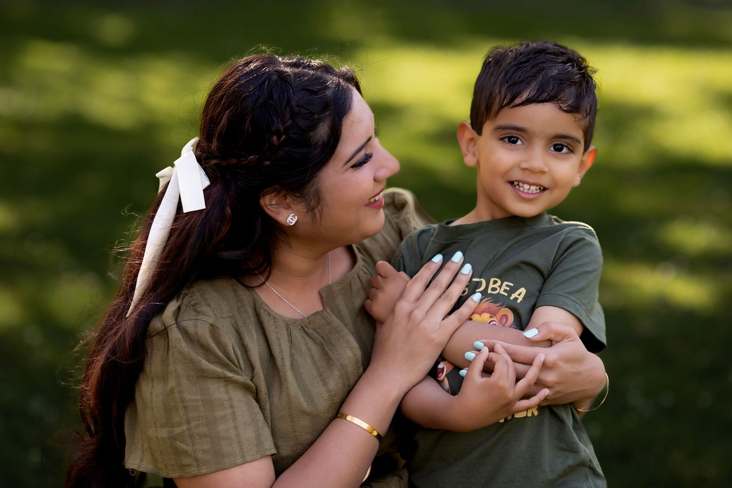 Mother and son portrait, capturing a joyful moment of connection and natural outdoor light