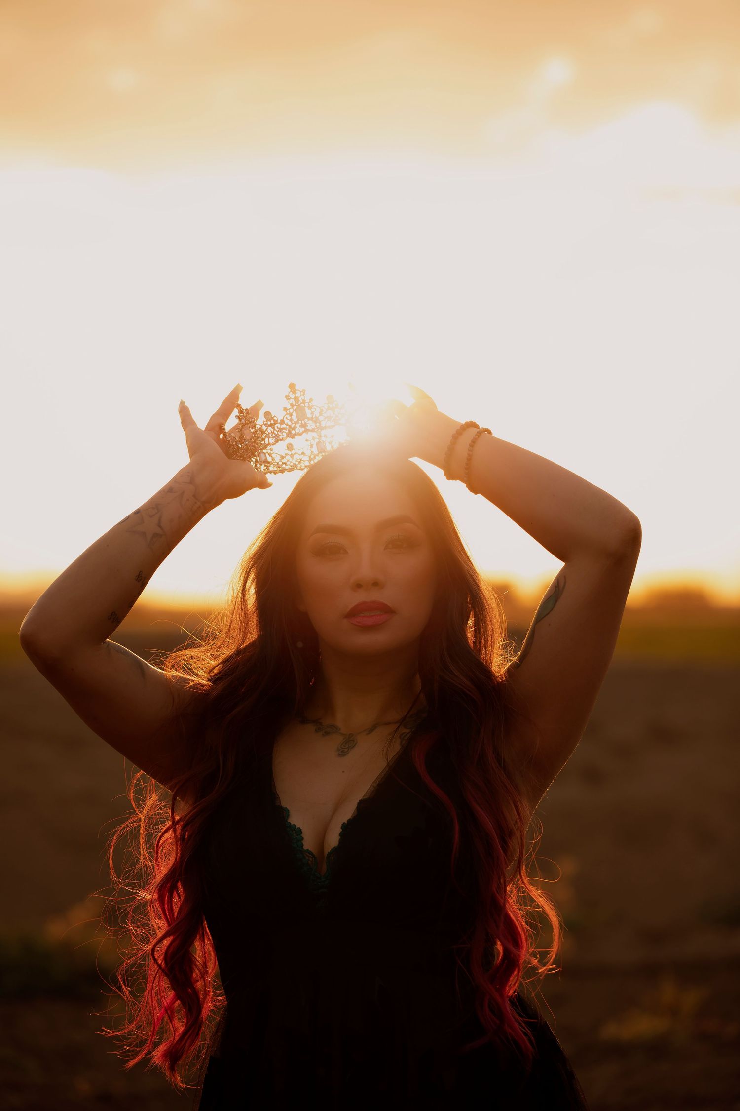 Woman illuminated by golden Sunset light in a creative portrait, celebrating wonder, self-expression, and natural beauty.