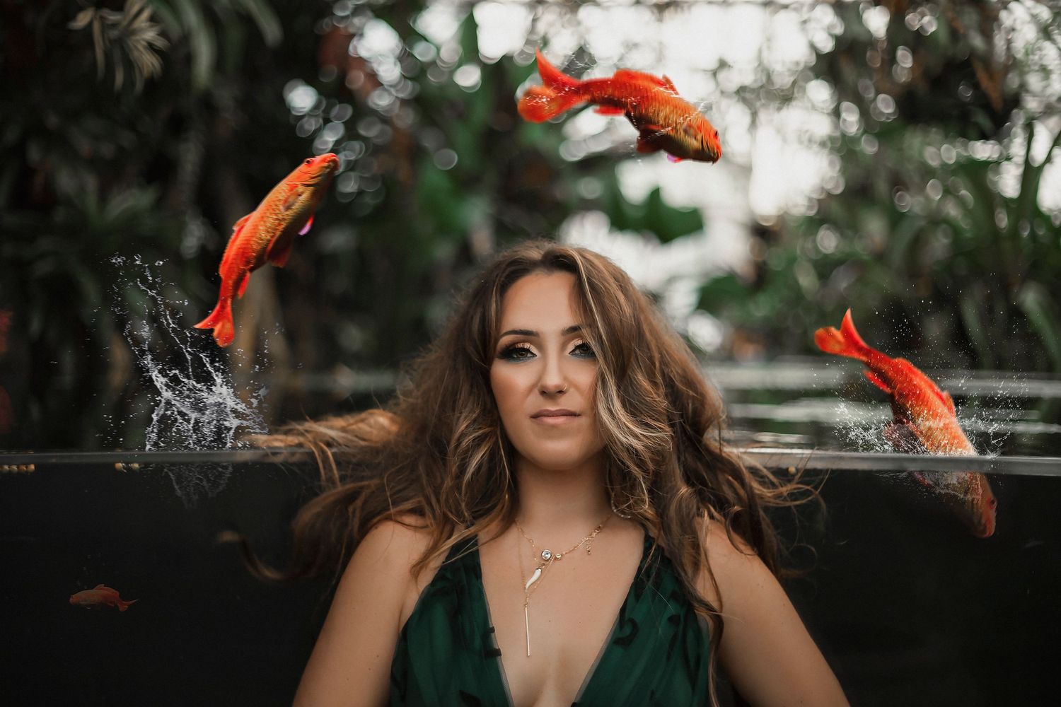 Creative, fine art portrait of a woman with Koi fish, blending storytelling, symbolism and natural beauty.