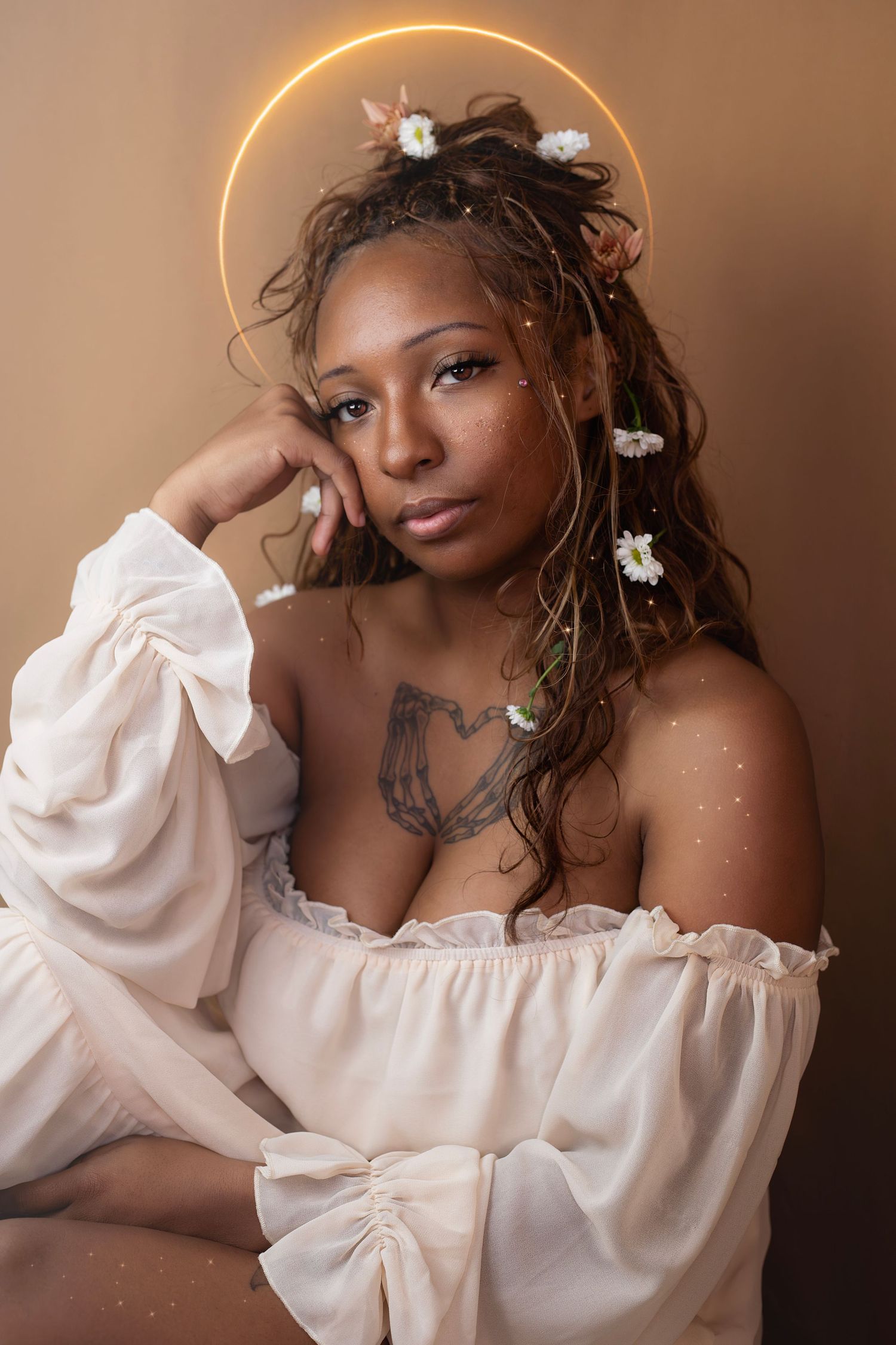 Creative portrait inspired by wonder, light, and storytelling with a celestial halo and floral accent.