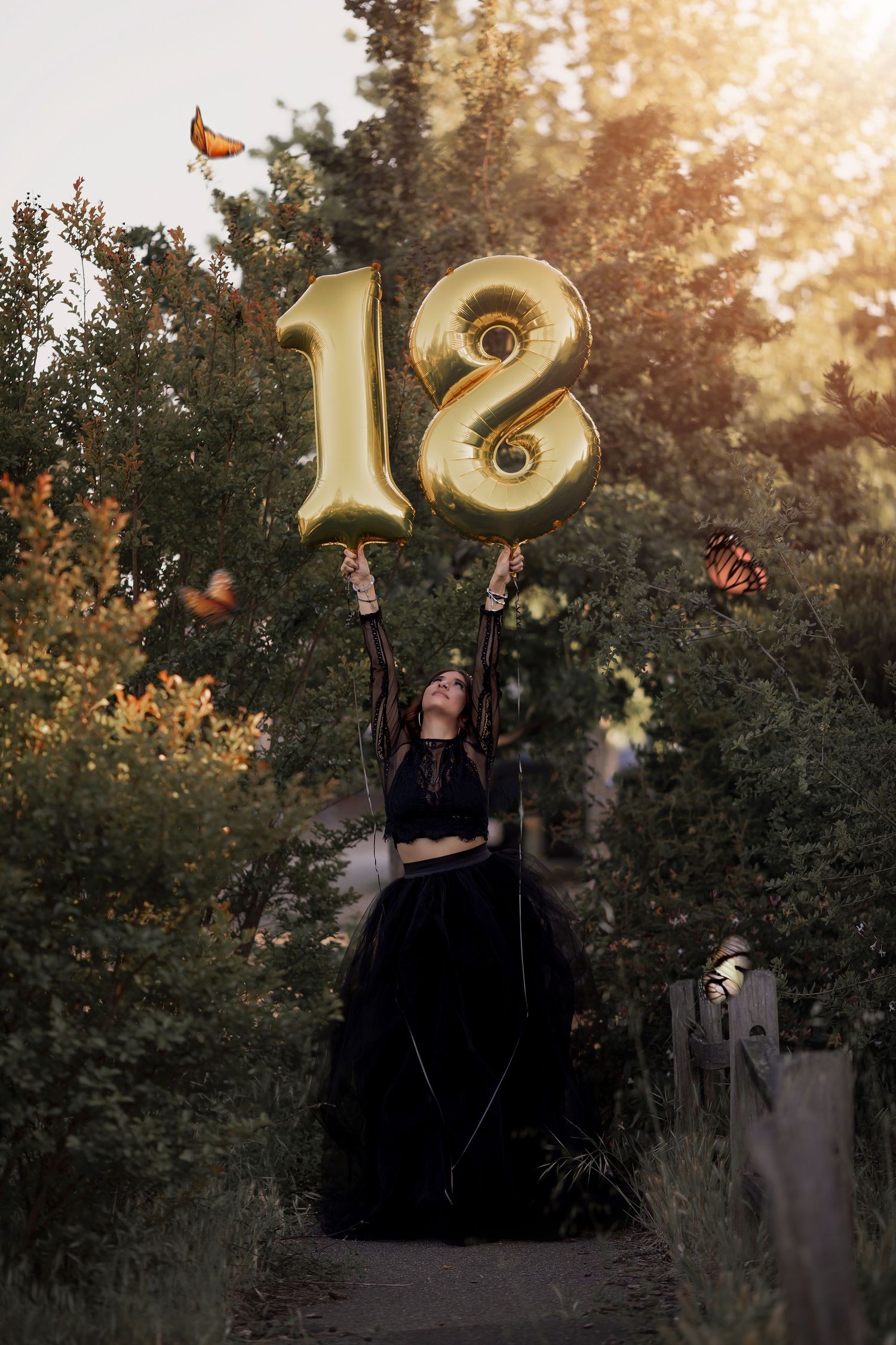 Creative senior portrait session celebrating an 18th birthday with golden light and storytelling.