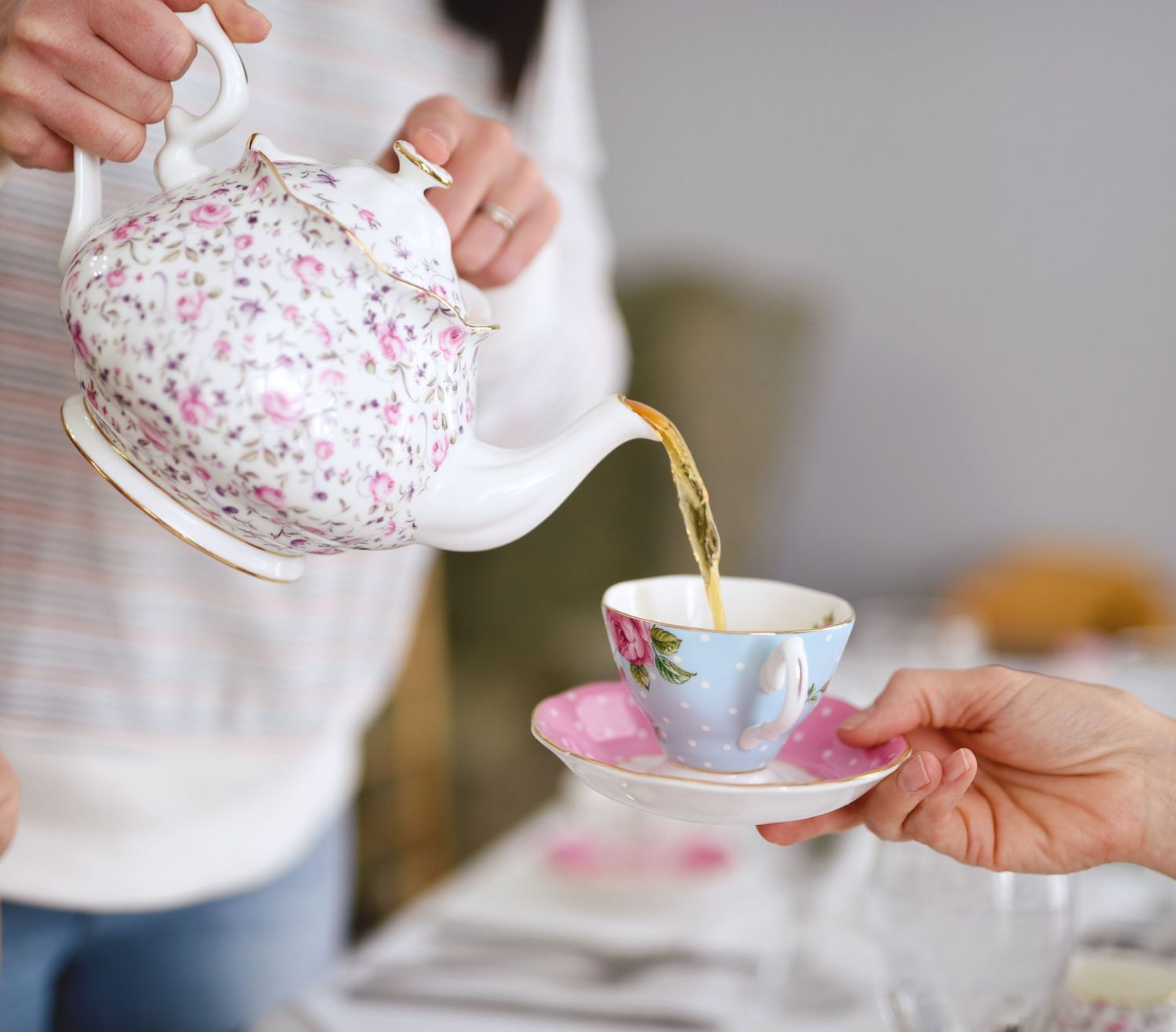 tea being poured into a teacup christina bowen unsplash