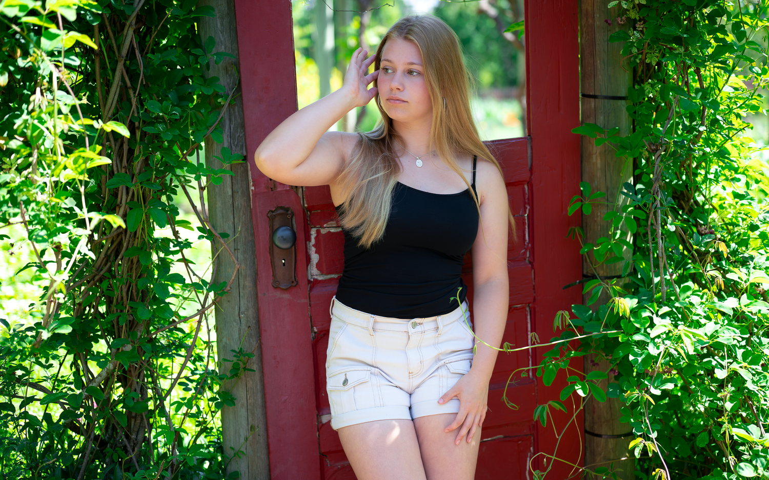 country portrait cowgirl hat flowers nature senior portrait photos season