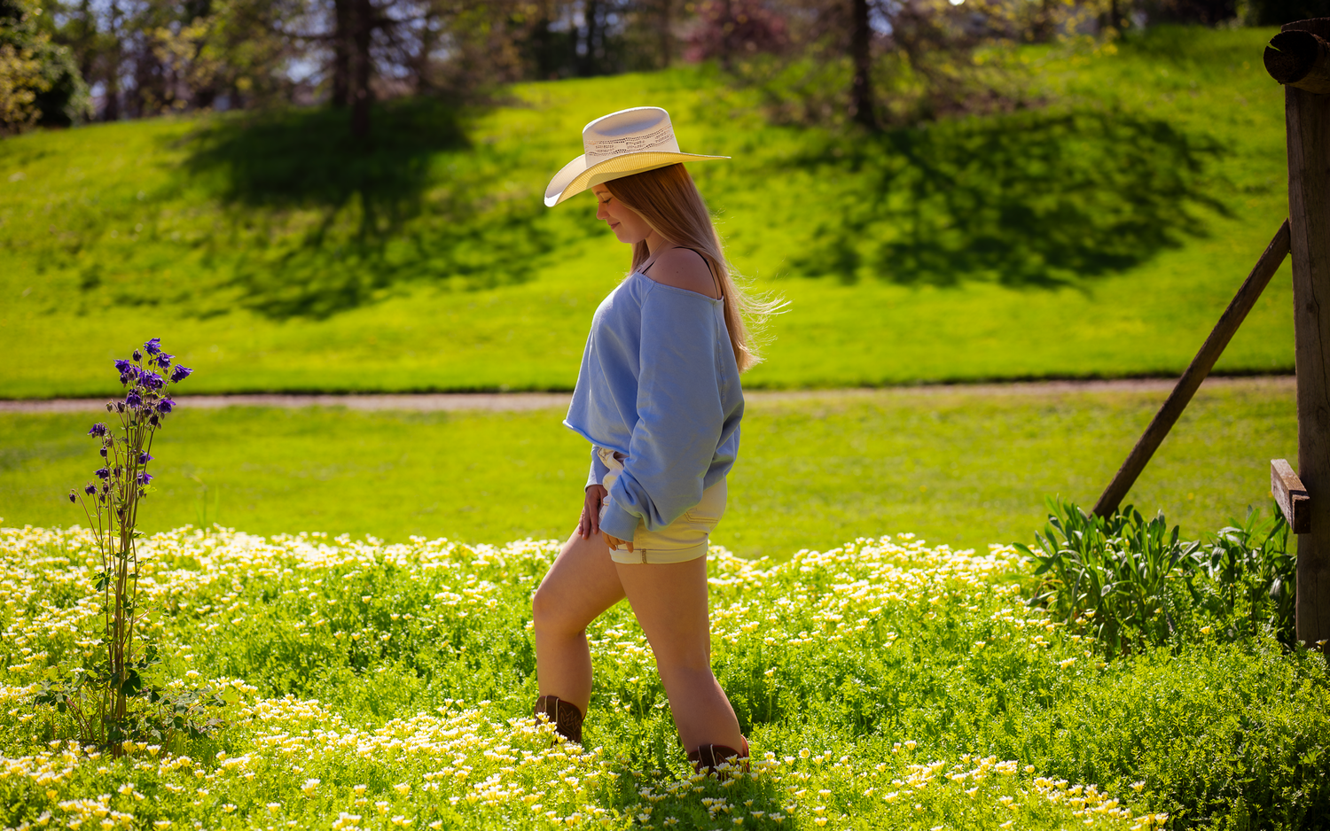 country portrait cowgirl hat flowers nature senior portrait photos season