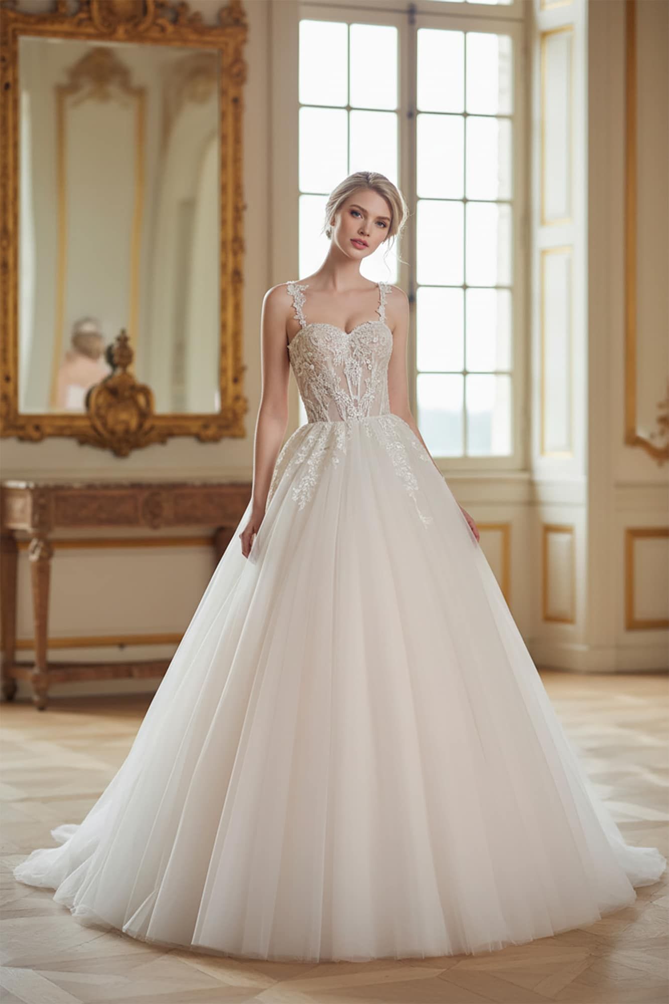 Bride in elegant ball gown wedding dress with lace bodice in a luxurious room.
