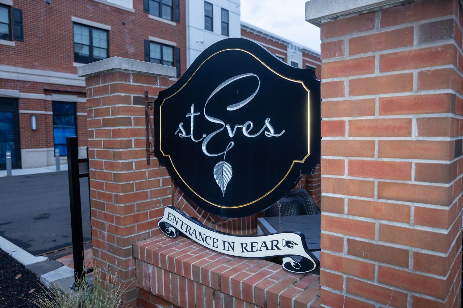 St. Eves entrance sign on brick wall with entrance in rear notice.
by Andrew Fein Photography - Family and Newborn Photo