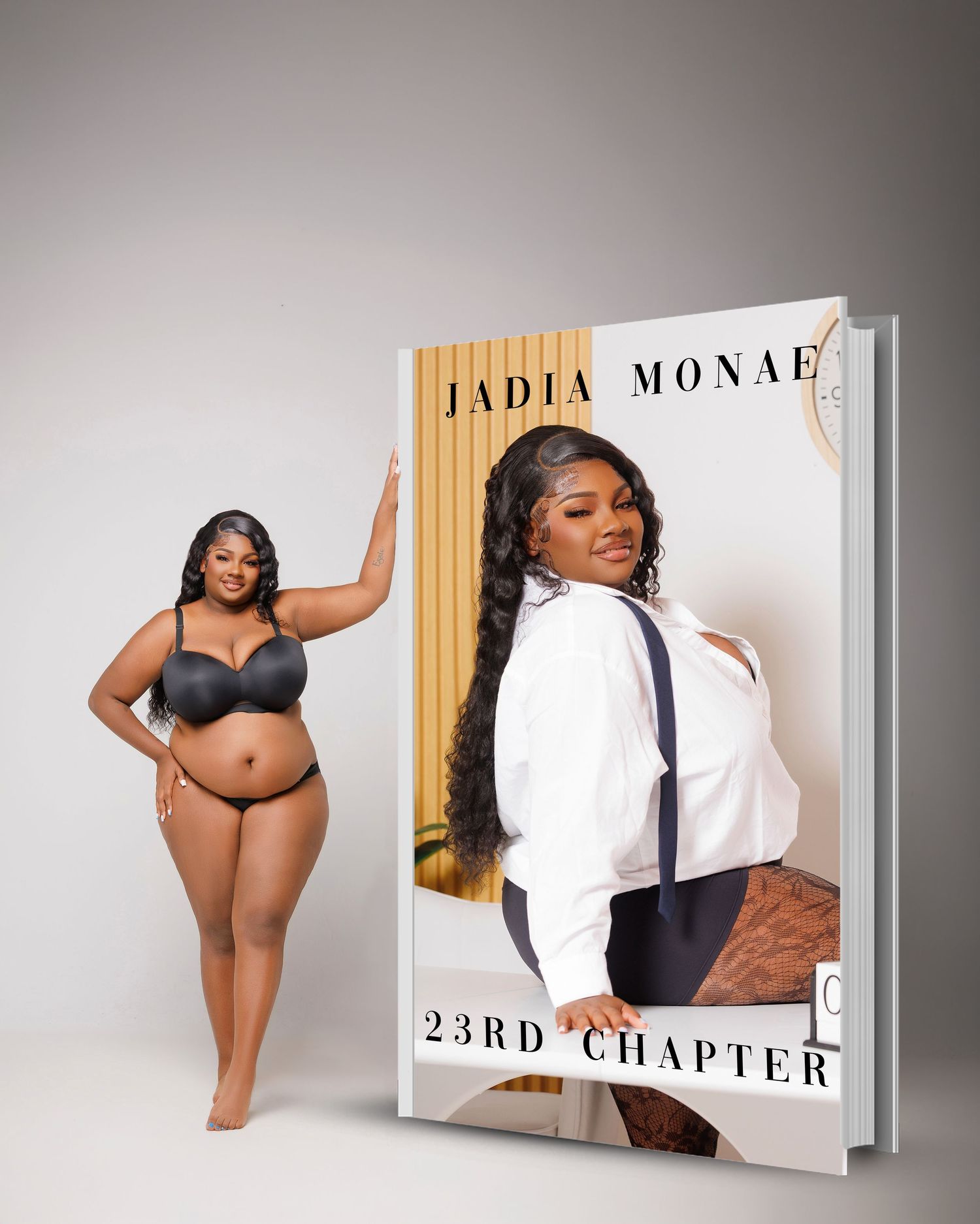 Woman posing beside a large book cover titled Jadia Monae 23rd Chapter in a studio setting.